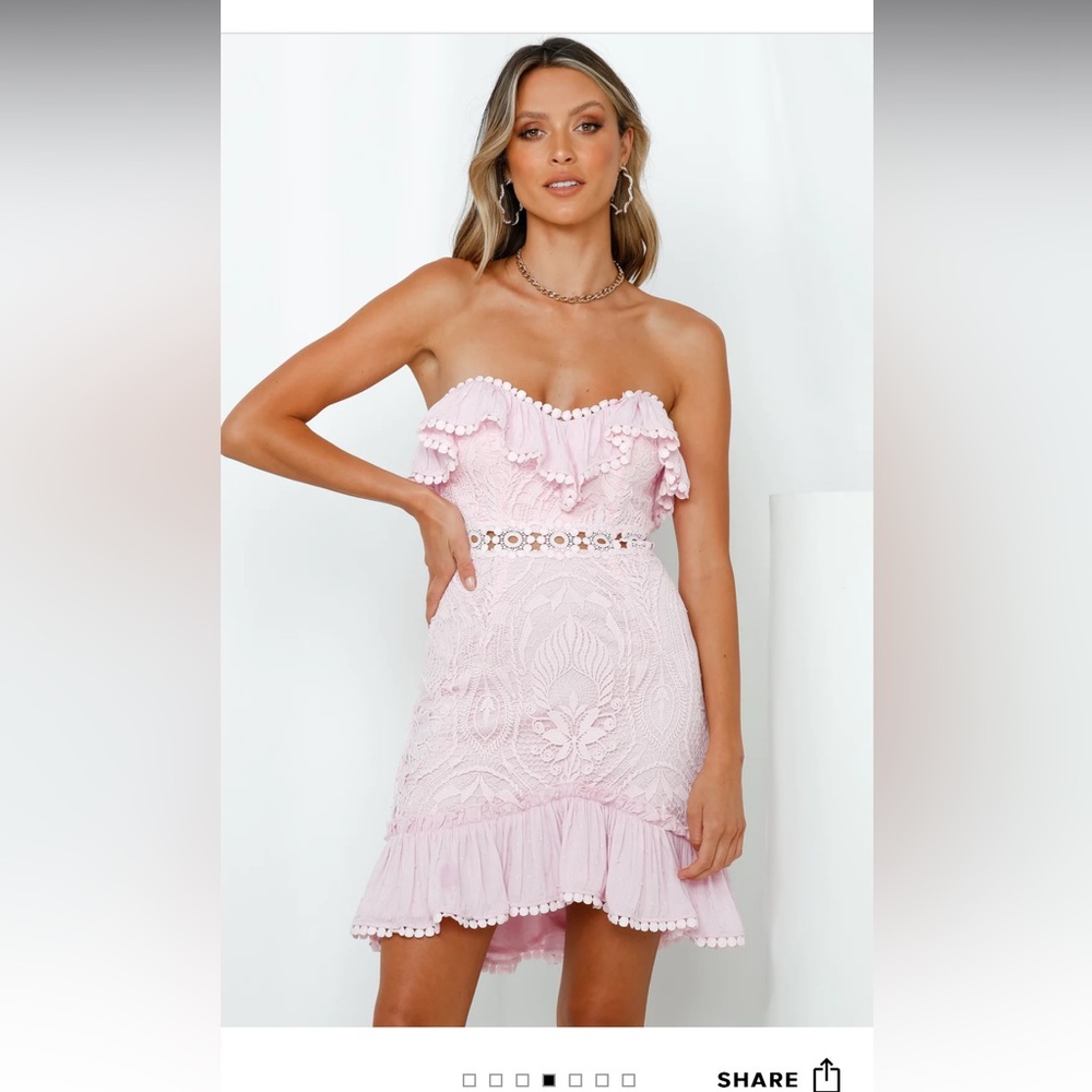 This is a pink, mini strapless dress. NWT size small